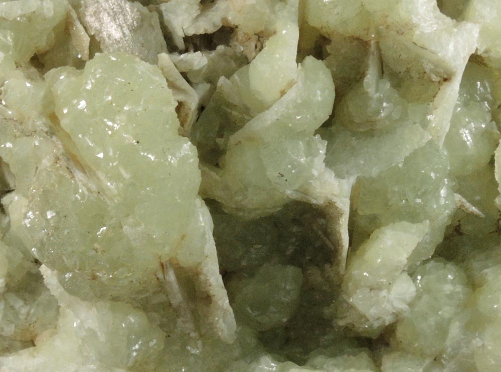 Prehnite with pseudomorphic cavities after bladed Anhydrite crystals from Prospect Park Quarry, Prospect Park, Passaic County, New Jersey