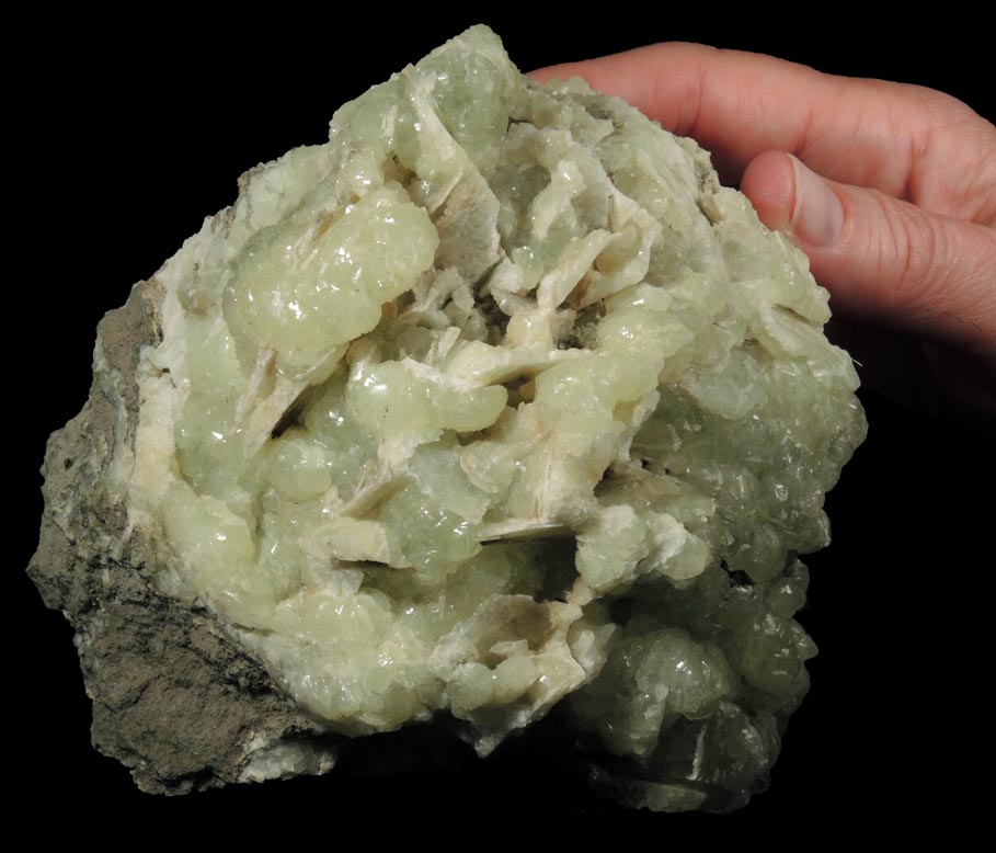 Prehnite with pseudomorphic cavities after bladed Anhydrite crystals from Prospect Park Quarry, Prospect Park, Passaic County, New Jersey