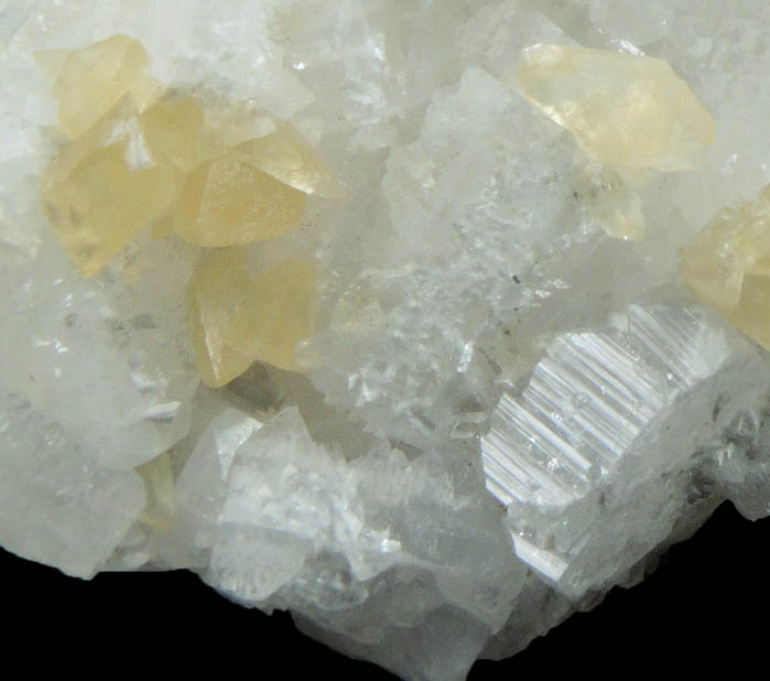 Hydroxyapophyllite-(K) (formerly apophyllite-(KOH)) with twinned Calcite from Goose Creek Quarry, near Leesburg, Loudon County, Virginia