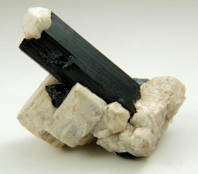 Arfvedsonite (rare twinned terminated Arfvedsonite crystal) on Microcline from Hurricane Mountain, east of Intervale, Carroll County, New Hampshire