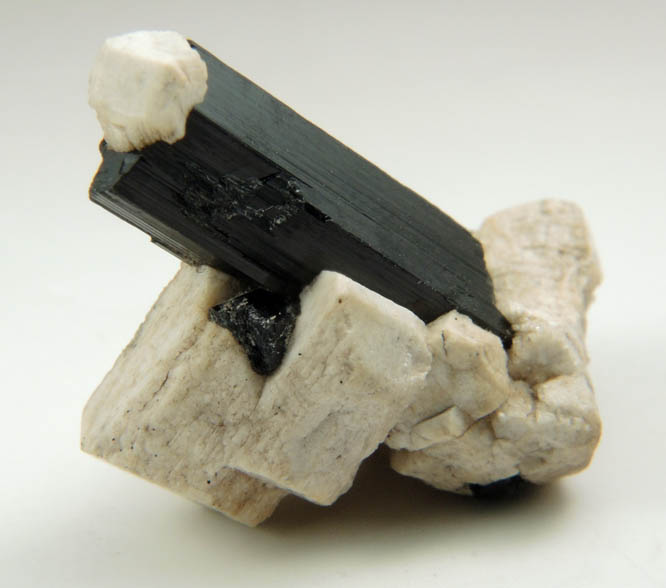 Arfvedsonite (rare twinned terminated Arfvedsonite crystal) on Microcline from Hurricane Mountain, east of Intervale, Carroll County, New Hampshire