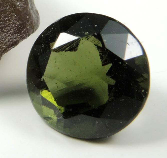 Moldavite (Tektite  natural glass caused by meteorite impact) with 3.95 carat faceted gemstone from Vltava (Moldau) River, southern Bohemia, Czech Republic (Type Locality for Moldavite)