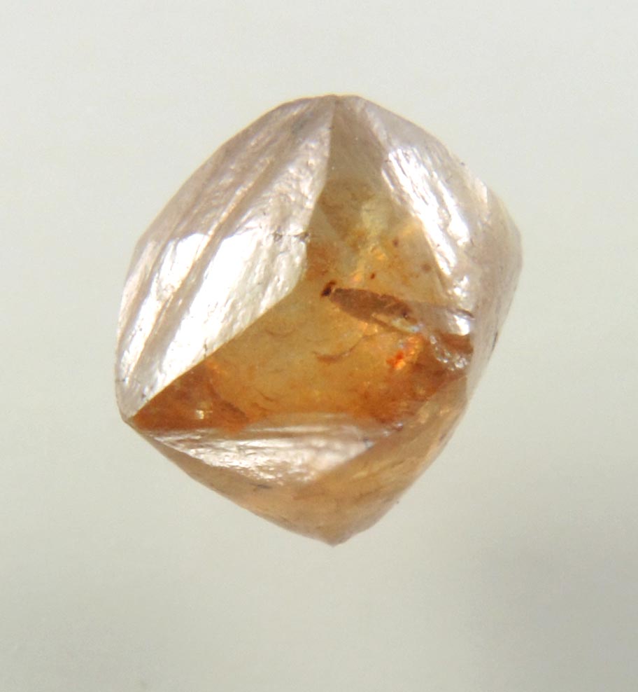 Diamond (1.49 carat orange-brown octahedral rough diamond) from Northern Cape Province, South Africa