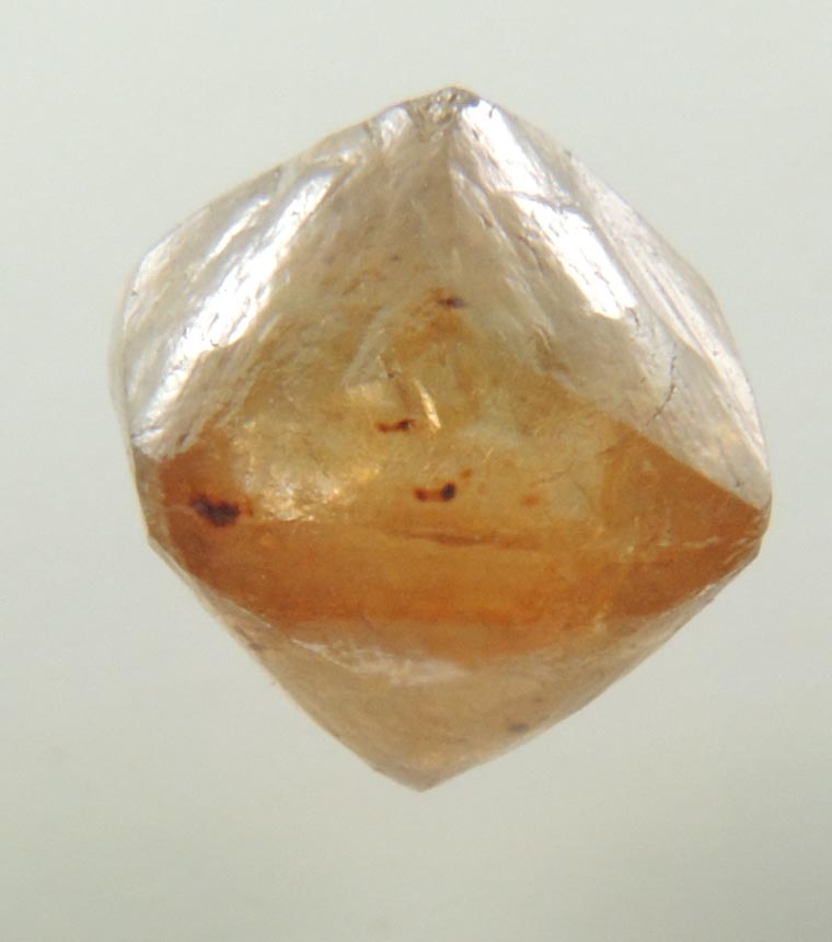 Diamond (1.49 carat orange-brown octahedral rough diamond) from Northern Cape Province, South Africa