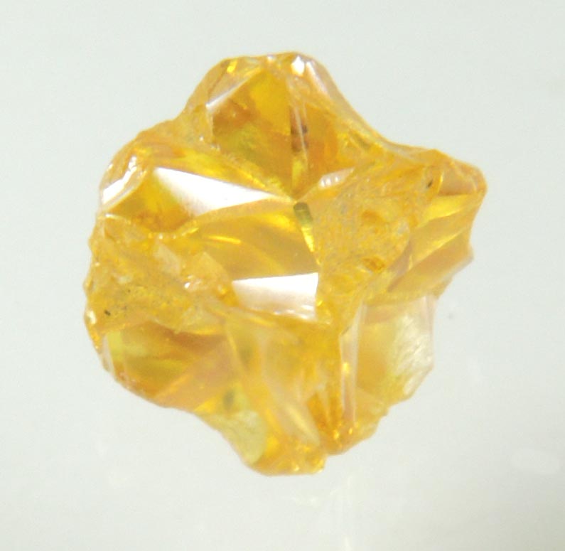 Diamond (0.60 carat fancy intense-yellow cavernous cubic crystal) from Mbuji-Mayi, 300 km east of Tshikapa, Democratic Republic of the Congo