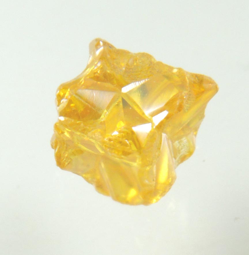 Diamond (0.60 carat fancy intense-yellow cavernous cubic crystal) from Mbuji-Mayi, 300 km east of Tshikapa, Democratic Republic of the Congo