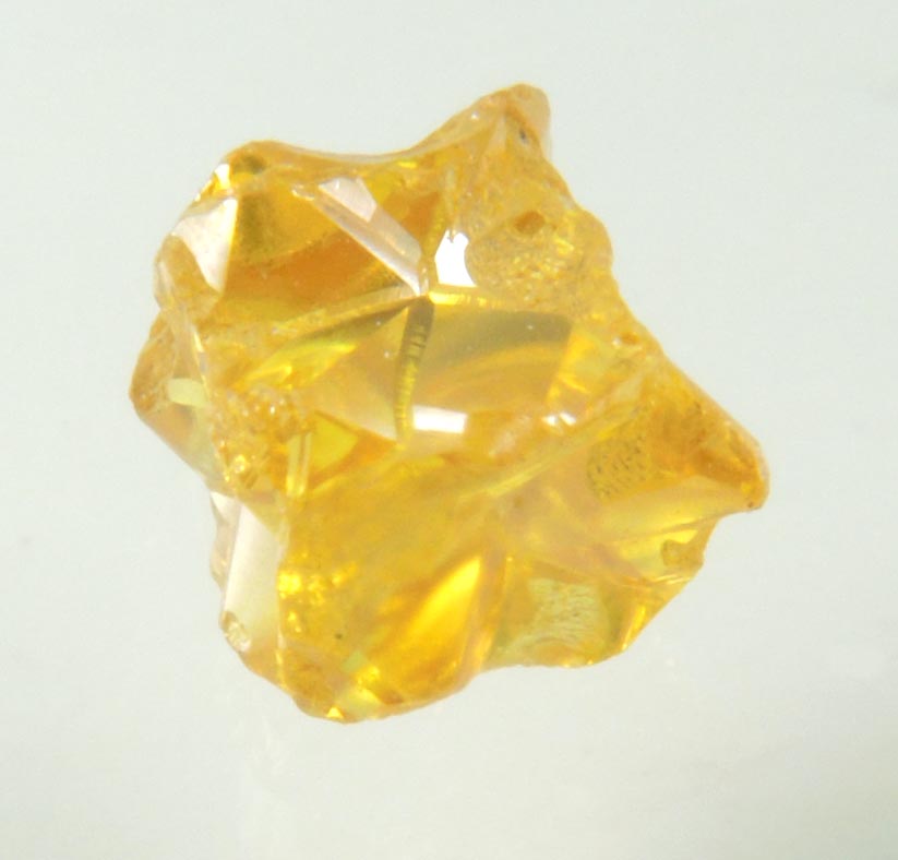 Diamond (0.60 carat fancy intense-yellow cavernous cubic crystal) from Mbuji-Mayi, 300 km east of Tshikapa, Democratic Republic of the Congo