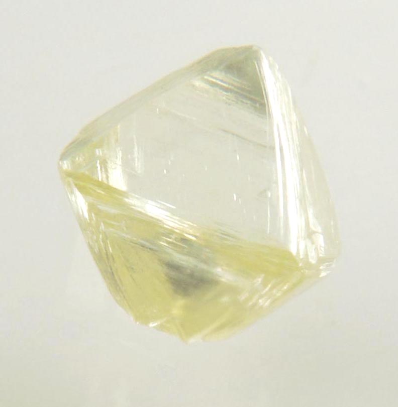 Diamond (0.87 carat yellow cuttable gem-quality asymmetric octahedral uncut diamond) from Jwaneng Mine, Naledi River Valley, Botswana