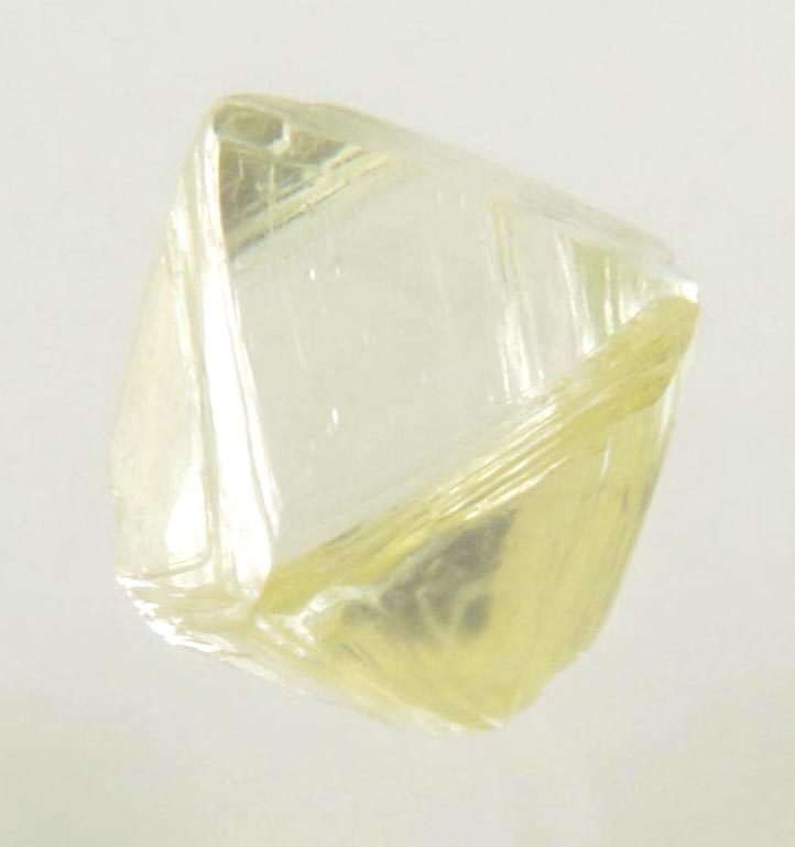 Diamond (0.87 carat yellow cuttable gem-quality asymmetric octahedral uncut diamond) from Jwaneng Mine, Naledi River Valley, Botswana