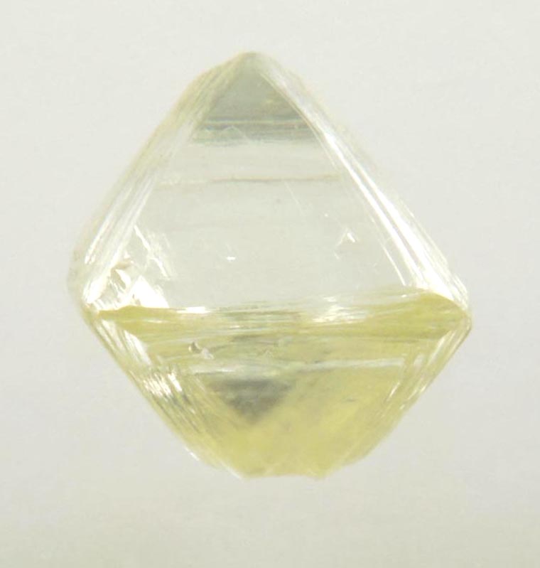 Diamond (0.87 carat yellow cuttable gem-quality asymmetric octahedral uncut diamond) from Jwaneng Mine, Naledi River Valley, Botswana