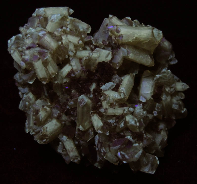 Photo below under shortwave ultraviolet illumination of Barite with Calcite from Dee Mine, Bootstrap District, Elko County, Nevada Barite with Calcite from Dee Mine, Bootstrap District, Elko County, Nevada