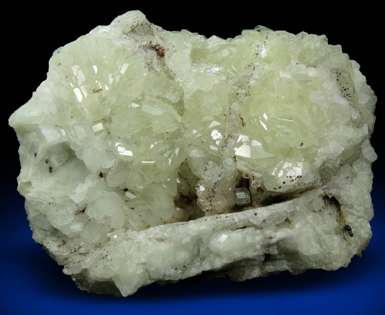 Datolite with pseudomorphic molds after Calcite plus minor Hematite from Braen's Quarry, Haledon, Passaic County, New Jersey