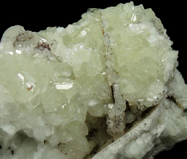 Datolite with pseudomorphic molds after Calcite plus minor Hematite from Braen's Quarry, Haledon, Passaic County, New Jersey