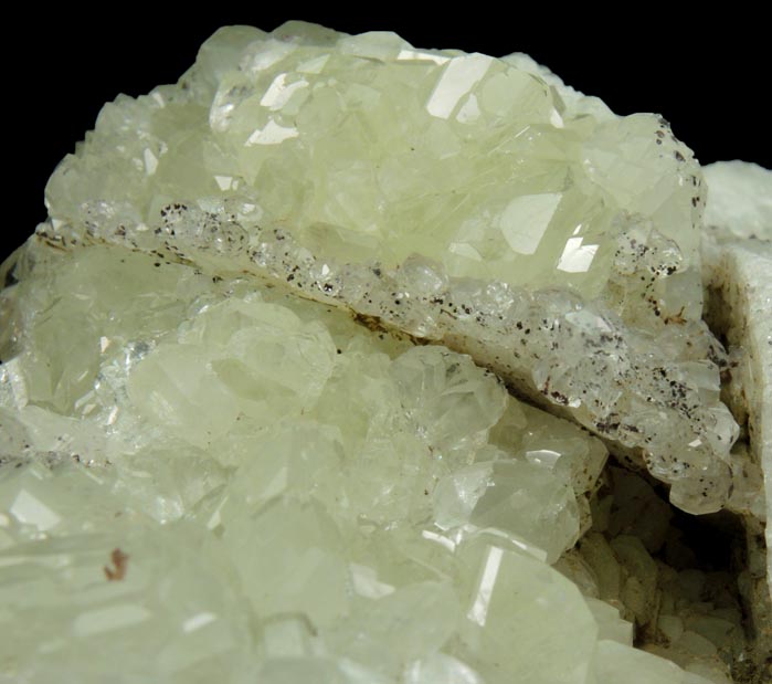 Datolite with pseudomorphic molds after Calcite plus minor Hematite from Braen's Quarry, Haledon, Passaic County, New Jersey