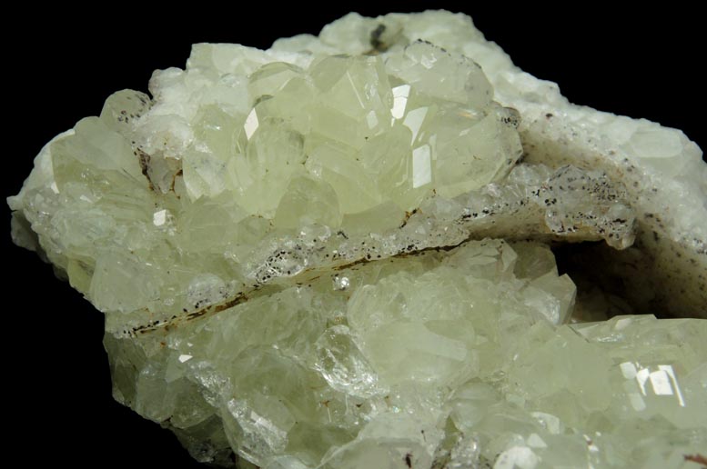 Datolite with pseudomorphic molds after Calcite plus minor Hematite from Braen's Quarry, Haledon, Passaic County, New Jersey