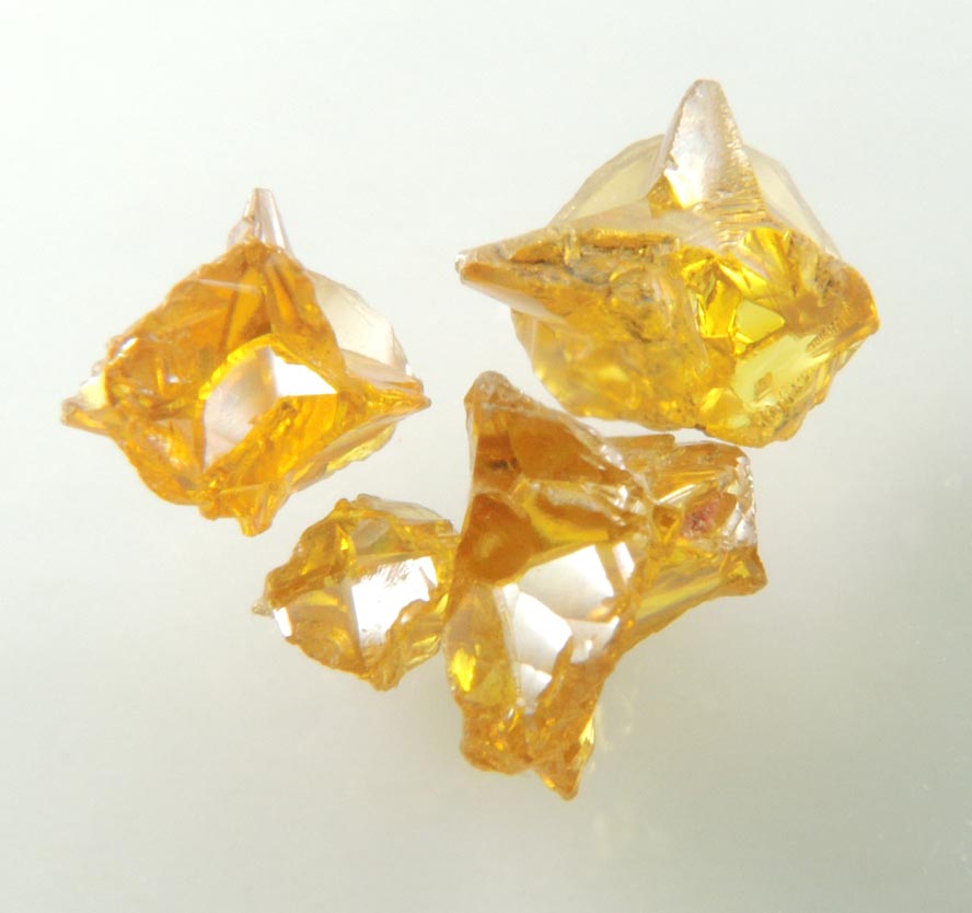 Diamond (set of four fancy-intense yellow cavernous crystals totaling 1.25 carats) from Mbuji-Mayi, 300 km east of Tshikapa, Democratic Republic of the Congo