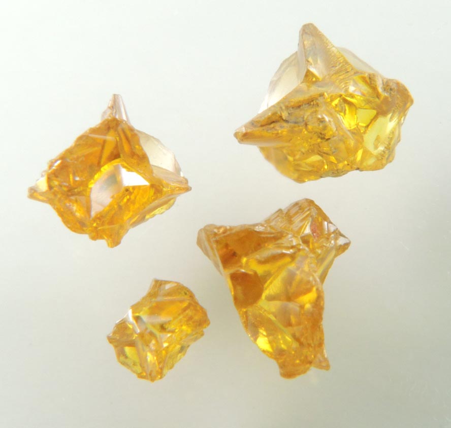 Diamond (set of four fancy-intense yellow cavernous crystals totaling 1.25 carats) from Mbuji-Mayi, 300 km east of Tshikapa, Democratic Republic of the Congo