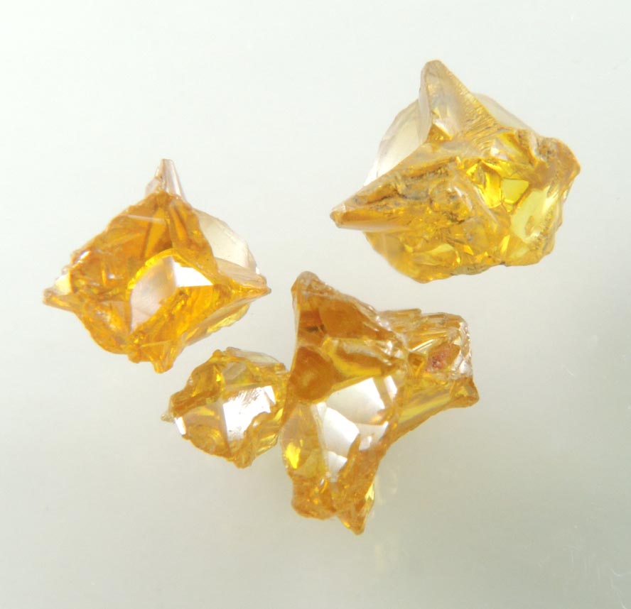 Diamond (set of four fancy-intense yellow cavernous crystals totaling 1.25 carats) from Mbuji-Mayi, 300 km east of Tshikapa, Democratic Republic of the Congo