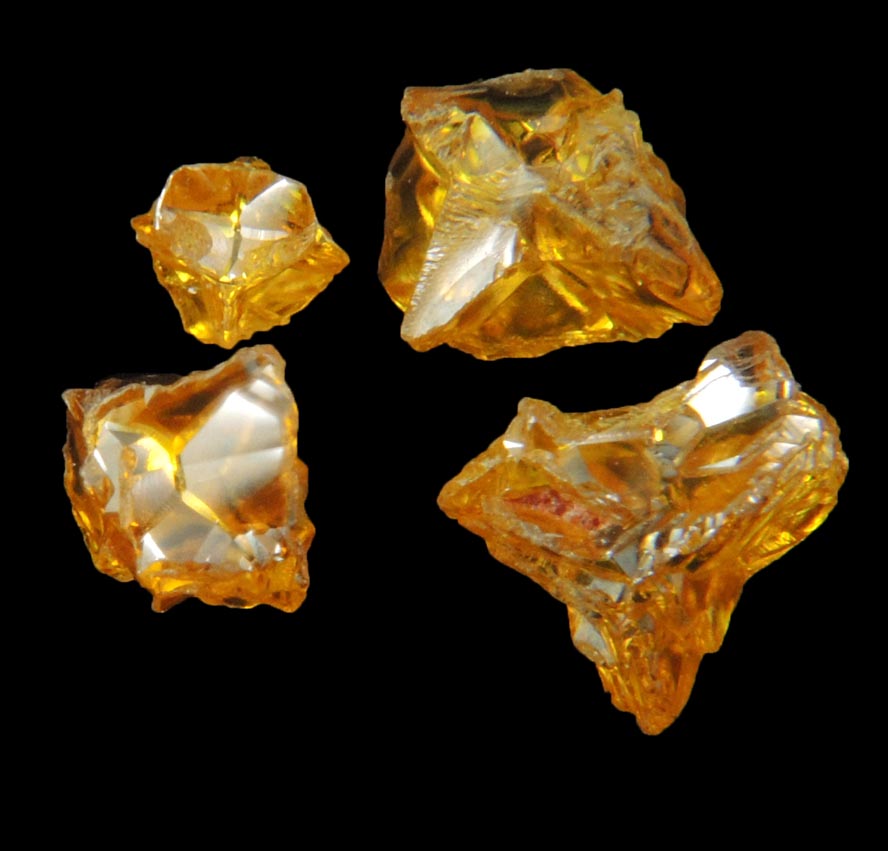 Diamond (set of four fancy-intense yellow cavernous crystals totaling 1.25 carats) from Mbuji-Mayi, 300 km east of Tshikapa, Democratic Republic of the Congo