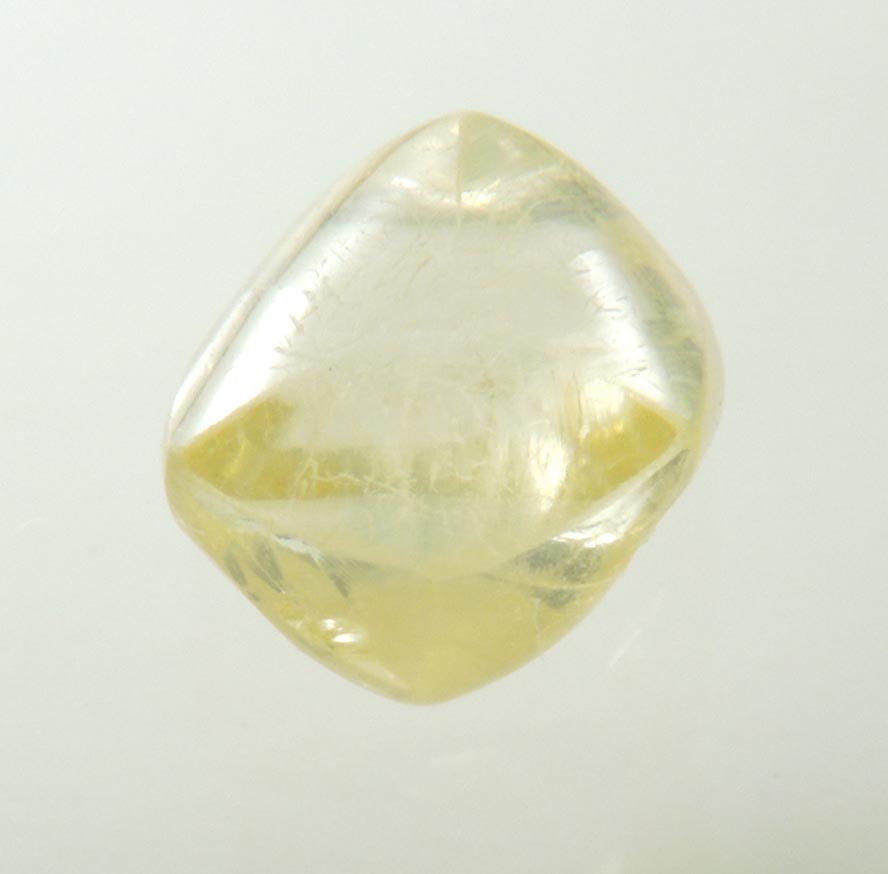 Diamond (1.04 carat gem-grade yellow flattened complex uncut diamond) from Oranjemund District, southern coastal Namib Desert, Namibia