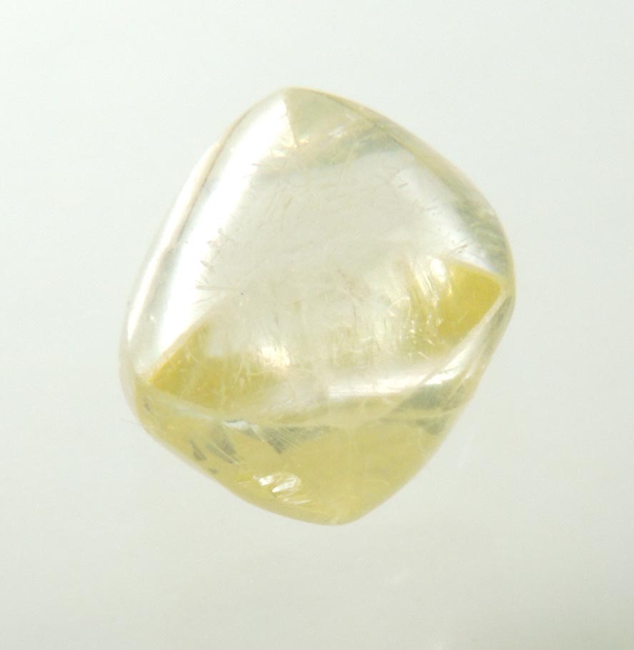 Diamond (1.04 carat gem-grade yellow flattened complex uncut diamond) from Oranjemund District, southern coastal Namib Desert, Namibia