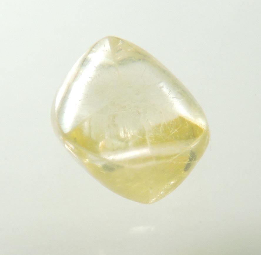 Diamond (1.04 carat gem-grade yellow flattened complex uncut diamond) from Oranjemund District, southern coastal Namib Desert, Namibia