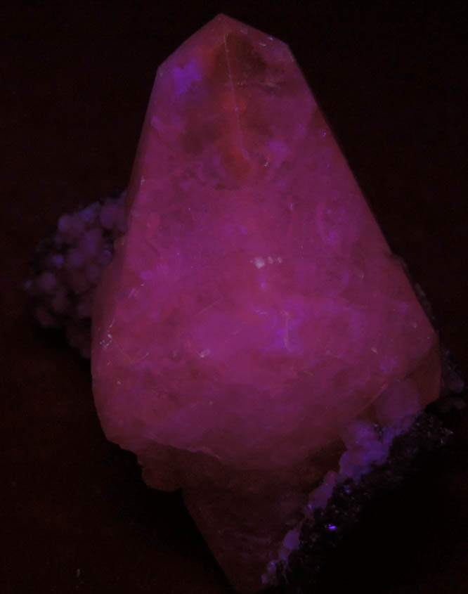 Photo below under shortwave ultraviolet illumination of Calcite over Marcasite and Sphalerite from Shullsburg District, Lafayette County, Wisconsin Calcite over Marcasite and Sphalerite from Shullsburg District, Lafayette County, Wisconsin