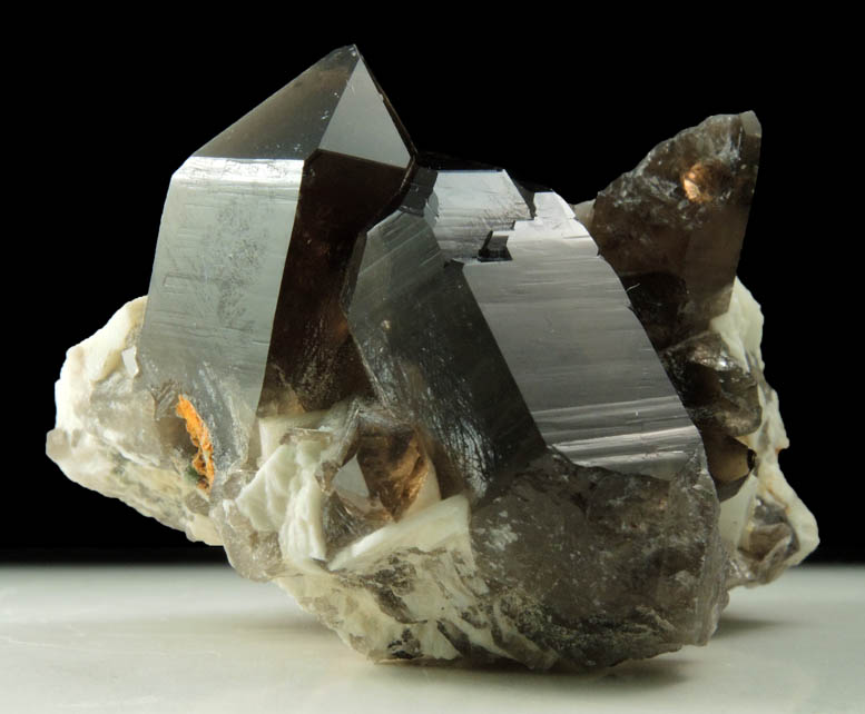 Quartz var. Smoky Quartz (Dauphiné Law Twins) on Microcline from Moat Mountain, Oliver Diggings, Hale's Location, west of North Conway, New Hampshire