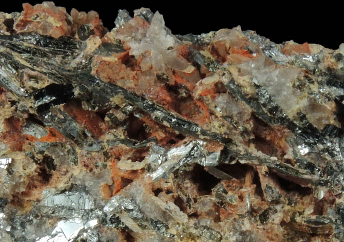 Stibnite with Klebelsbergite (acicular yellow-white), Metastibnite (red) from Miniera di Pereta, Scansano, Grosseto, Toscana, Italy