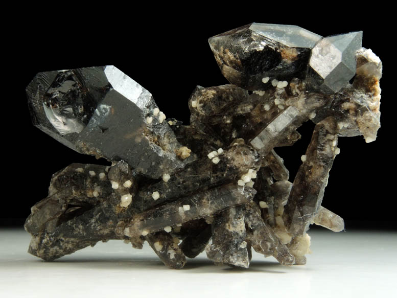 Gaidonnayite on Quartz var. Smoky Quartz (scepter-shaped crystals) from Poudrette Quarry, Mont Saint-Hilaire, Qubec, Canada