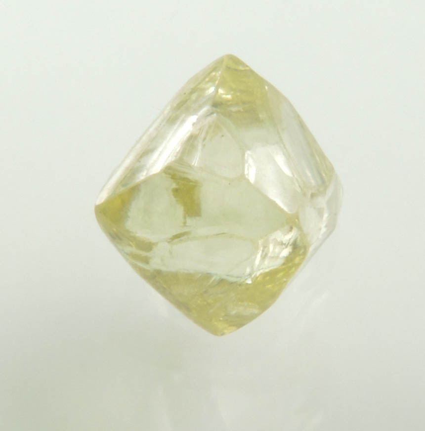 Diamond (1.36 carat gem-grade yellow octahedral uncut diamond) from Oranjemund District, southern coastal Namib Desert, Namibia