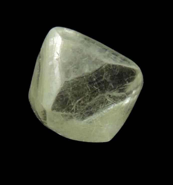 Diamond (1.23 carat gem-grade pale-yellow octahedral uncut diamond) from Oranjemund District, southern coastal Namib Desert, Namibia