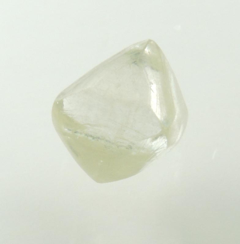 Diamond (1.23 carat gem-grade pale-yellow octahedral uncut diamond) from Oranjemund District, southern coastal Namib Desert, Namibia
