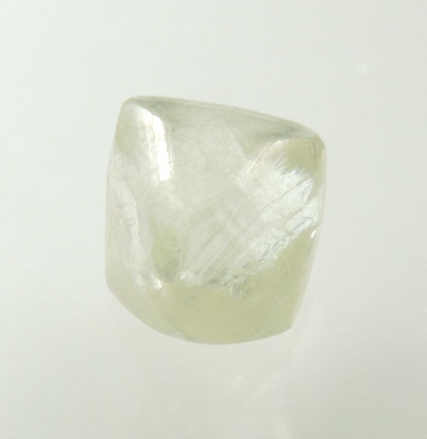 Diamond (1.23 carat gem-grade pale-yellow octahedral uncut diamond) from Oranjemund District, southern coastal Namib Desert, Namibia