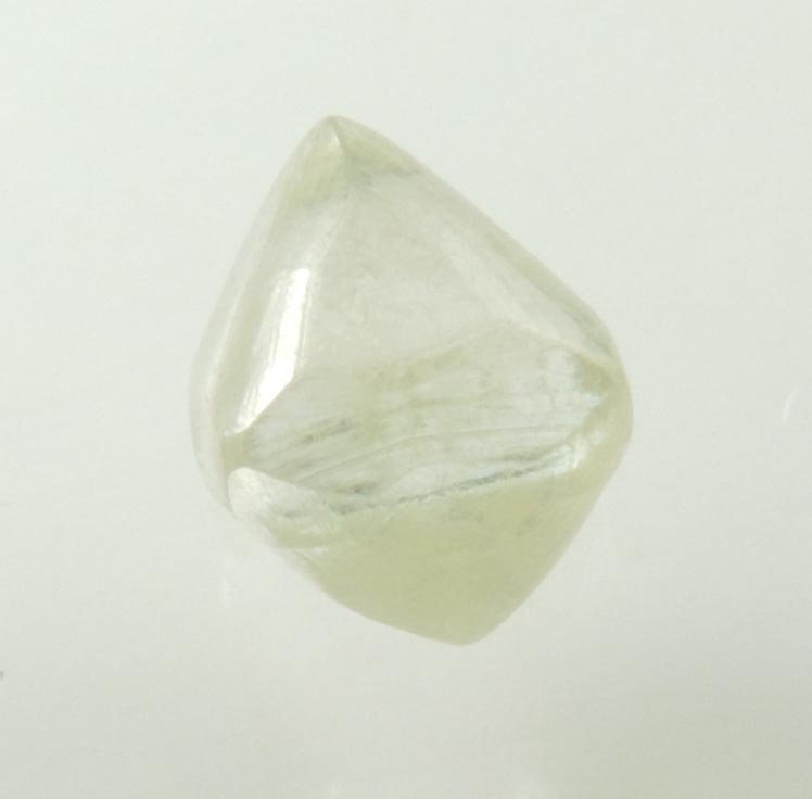 Diamond (1.23 carat gem-grade pale-yellow octahedral uncut diamond) from Oranjemund District, southern coastal Namib Desert, Namibia
