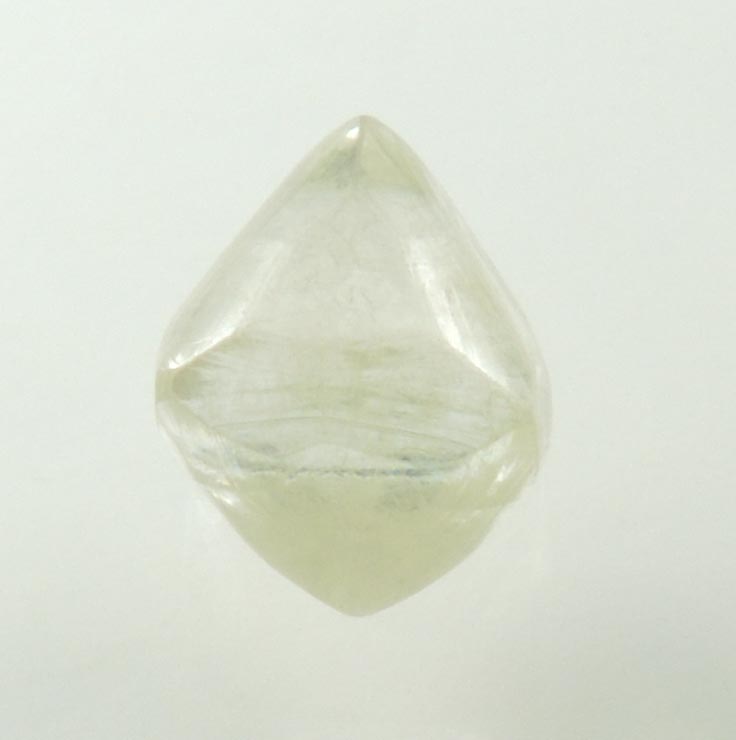 Diamond (1.23 carat gem-grade pale-yellow octahedral uncut diamond) from Oranjemund District, southern coastal Namib Desert, Namibia