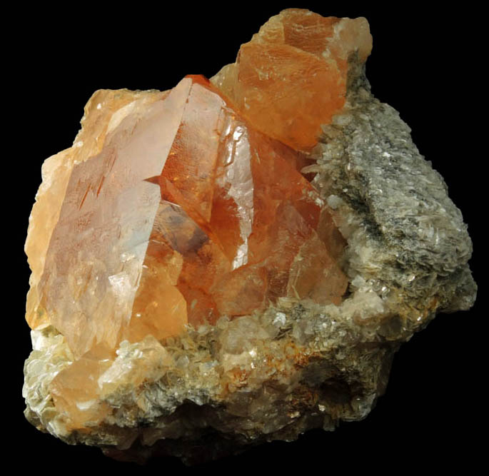 Scheelite on Muscovite with Cassiterite from Xuebaoding Mountain, near Pingwu, Sichuan Province, China