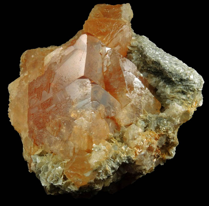 Scheelite on Muscovite with Cassiterite from Xuebaoding Mountain, near Pingwu, Sichuan Province, China