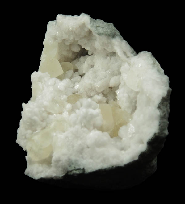 Calcite on Quartz from Hoosier Stone and Concrete Corp. Quarry, near Salem, Washington County, Indiana