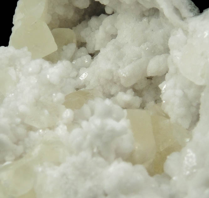 Calcite on Quartz from Hoosier Stone and Concrete Corp. Quarry, near Salem, Washington County, Indiana