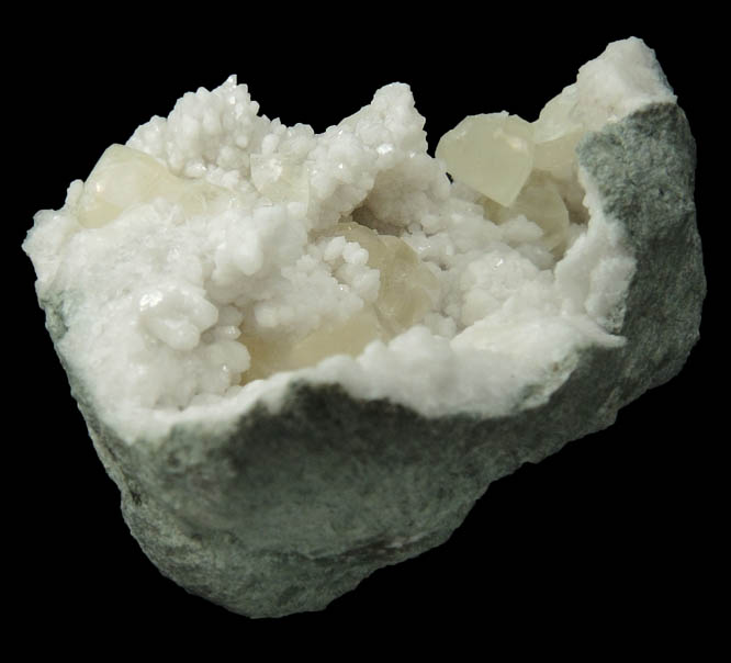 Calcite on Quartz from Hoosier Stone and Concrete Corp. Quarry, near Salem, Washington County, Indiana