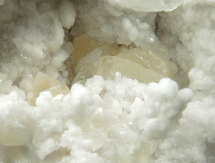 Calcite on Quartz from Hoosier Stone and Concrete Corp. Quarry, near Salem, Washington County, Indiana