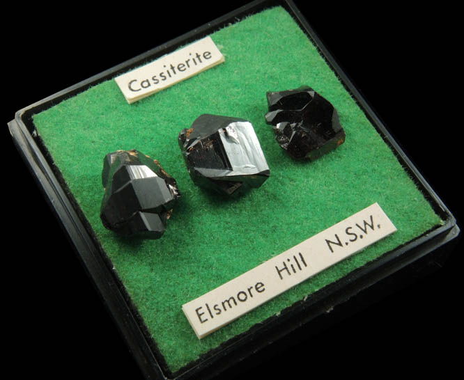 Cassiterite (3 mounted crystals) from Elsmore Hill, New South Wales, Australia