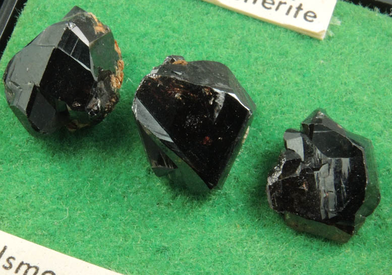 Cassiterite (3 mounted crystals) from Elsmore Hill, New South Wales, Australia