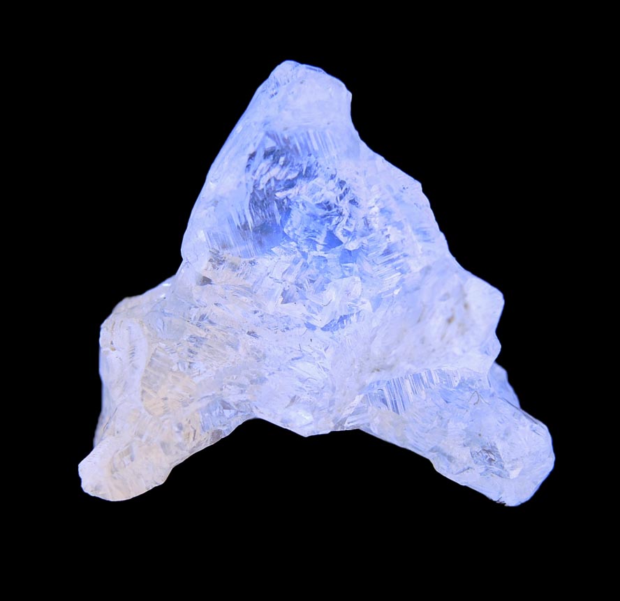 Photo below under longwave ultraviolet illumination of Diamond (9.16 carat yellow complex triangular rough diamond) from Vaal River Mining District, Northern Cape Province, South Africa Diamond (9.16 carat yellow complex triangular rough diamond) from Vaal River Mining District, Northern Cape Province, South Africa