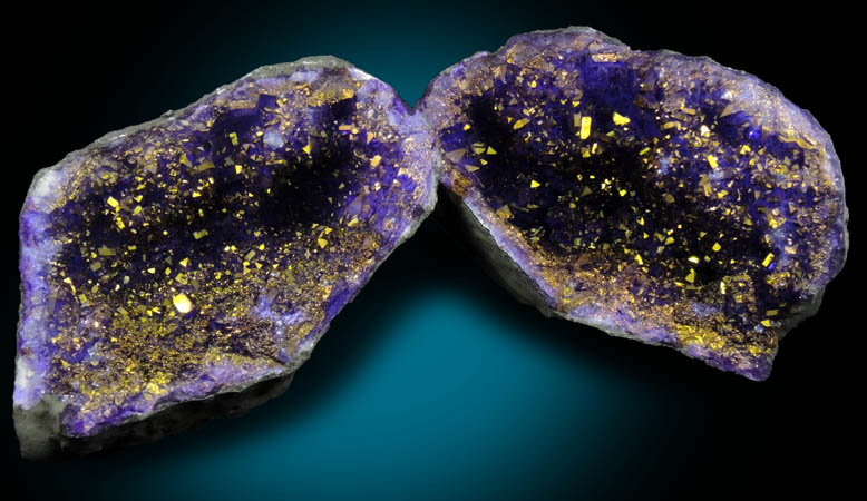 Quartz geode coated with yellow-metallic highlights over purple dye (FAKE) from Man-made