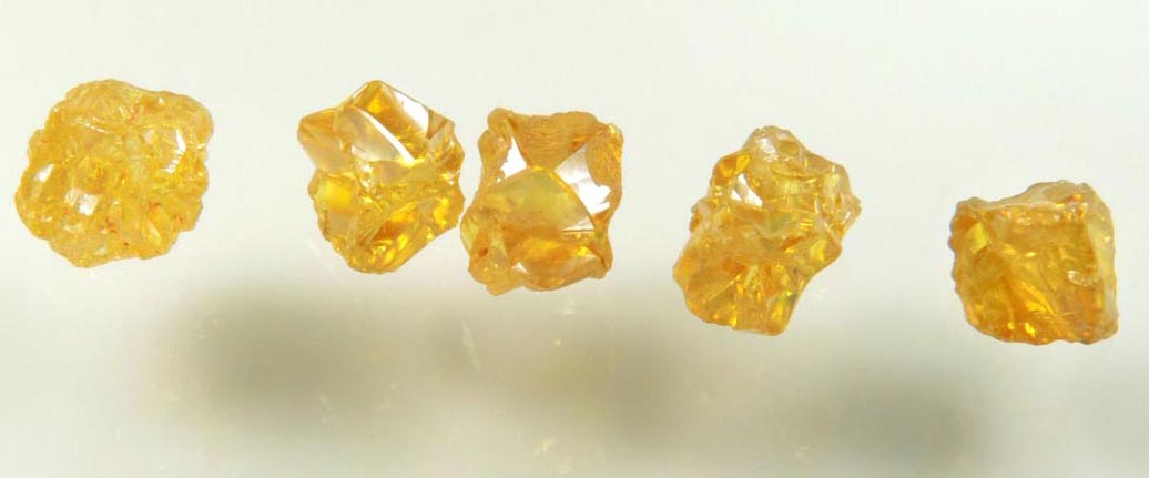 Diamond (five uncut fancy-yellow cavernous uncut rough diamonds totaling 2.93 carats) from Mbuji-Mayi, 300 km east of Tshikapa, Democratic Republic of the Congo