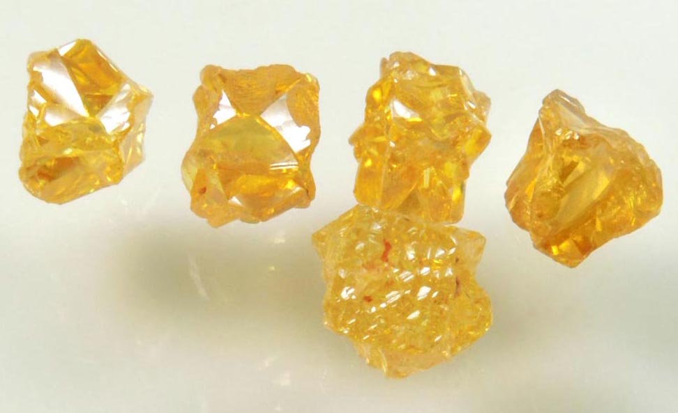 Diamond (five uncut fancy-yellow cavernous uncut rough diamonds totaling 2.93 carats) from Mbuji-Mayi, 300 km east of Tshikapa, Democratic Republic of the Congo