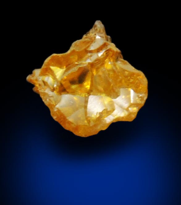 Diamond (0.56 carat uncut fancy intense yellow cavernous uncut diamond) from Mbuji-Mayi, 300 km east of Tshikapa, Democratic Republic of the Congo