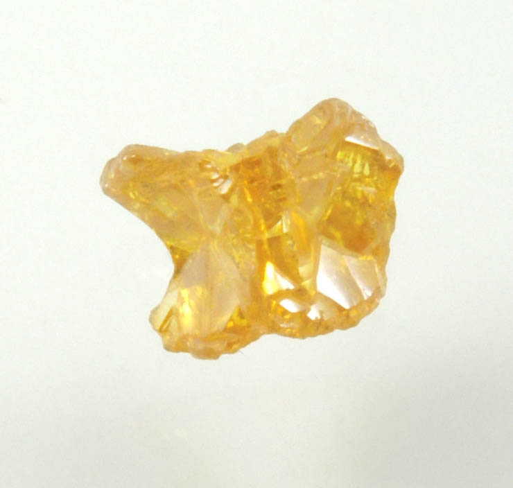 Diamond (0.56 carat uncut fancy intense yellow cavernous uncut diamond) from Mbuji-Mayi, 300 km east of Tshikapa, Democratic Republic of the Congo